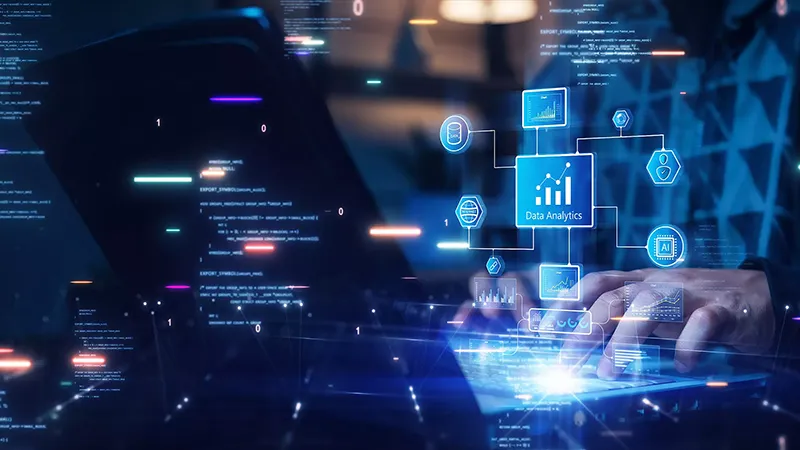 A person typing on a laptop with a visual overlay of data analytics, AI, databases, and graphs.